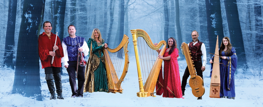 Lori Pappajohn with Winter Harp Ensemble holding harps and other instruments.
